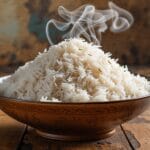 Perfectly cooked basmati rice in a bowl with steam rising.